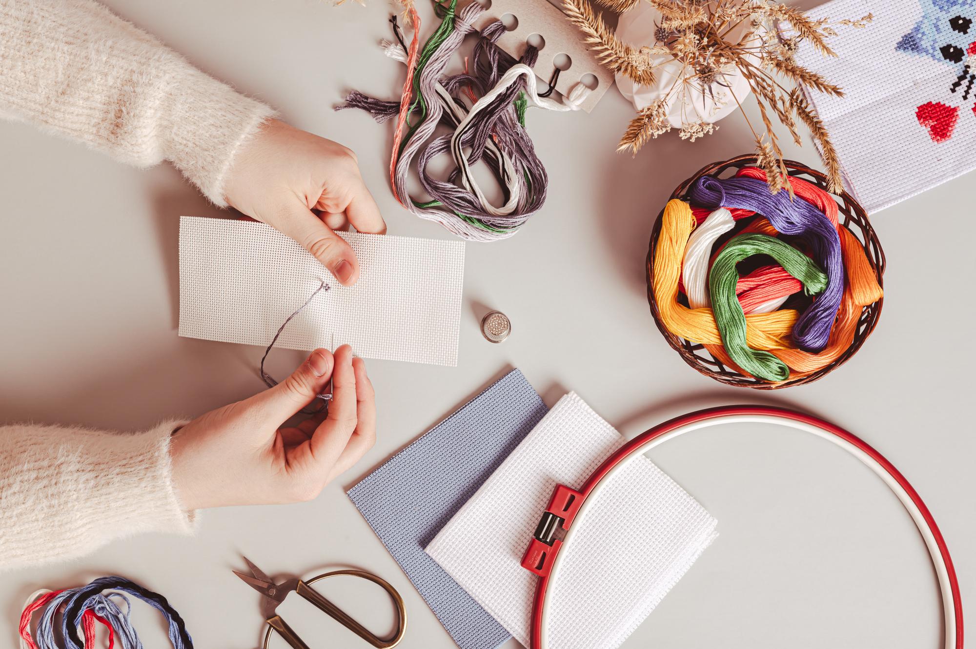 studio hands arranging thread cards