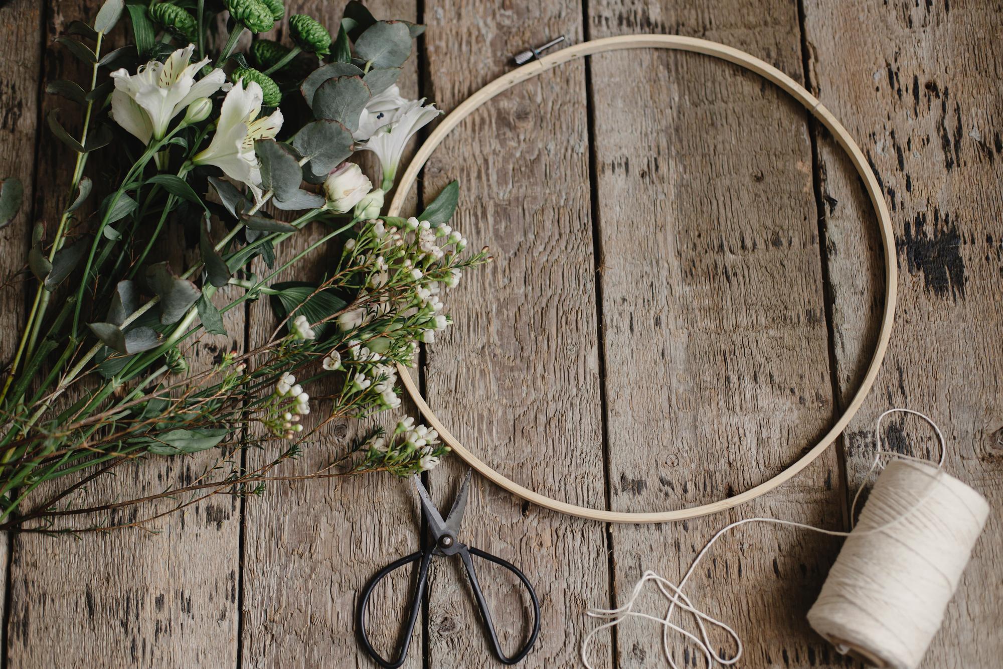 artisan sewing hoop with floral embroidery in soft light